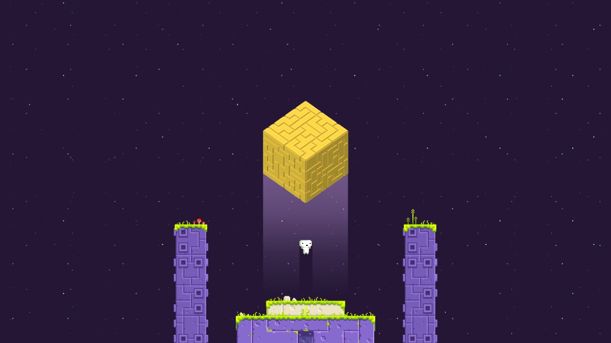 A screenshot showing the protagonist of Fez below a floating golden cube.