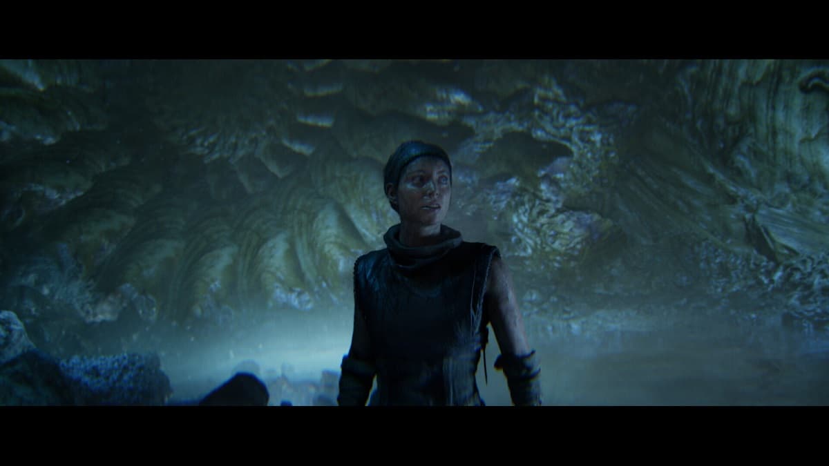 Senua in a dark cave in Senua's Saga: Hellblade 2