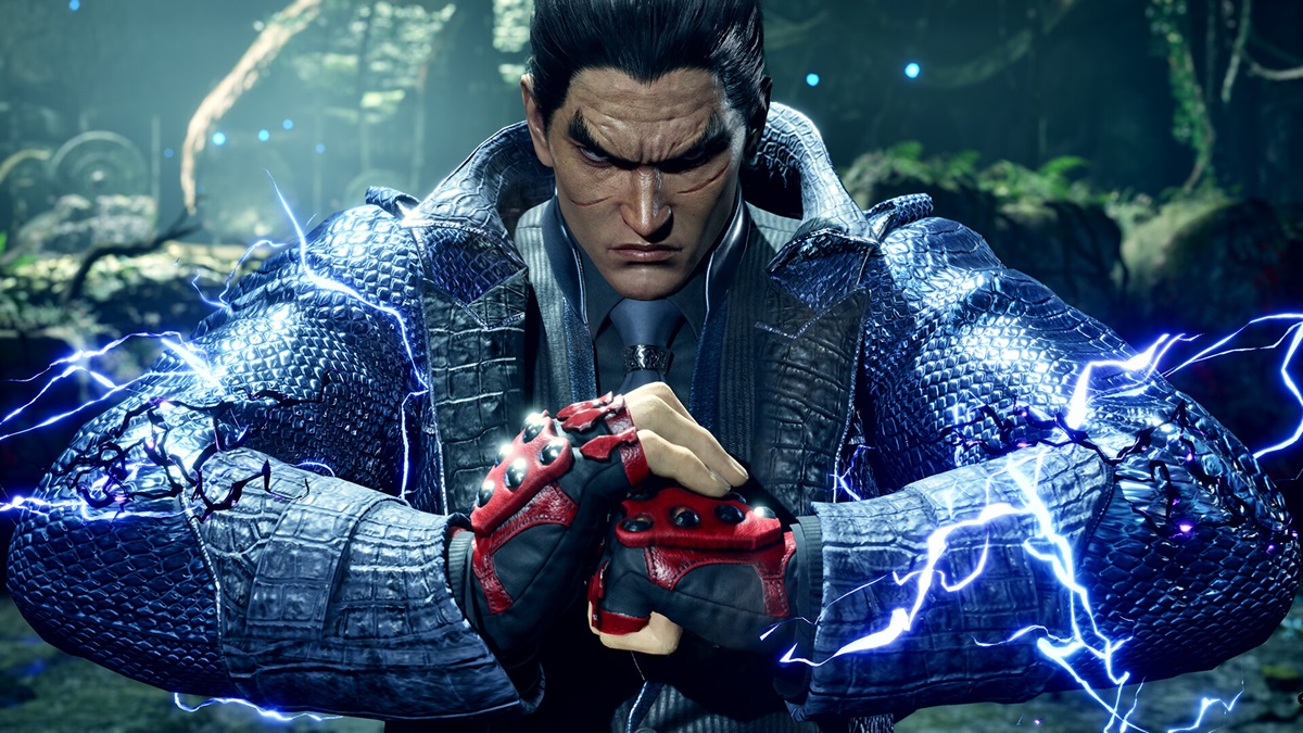 Kazuya in a blue jacket pushing his fists together with lightning up his arm.